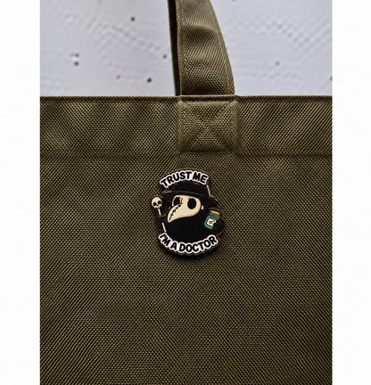 Trust Me I'm a Doctor wooden printed pin on olive green bag